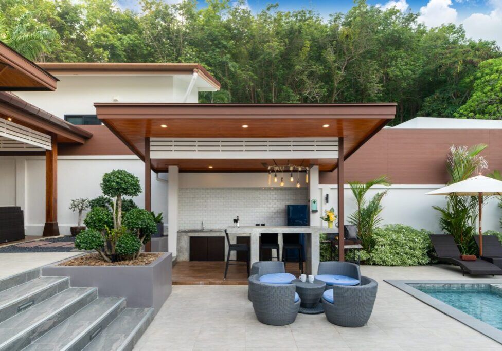 Outdoor swimming pool with counter bar in pool terrace